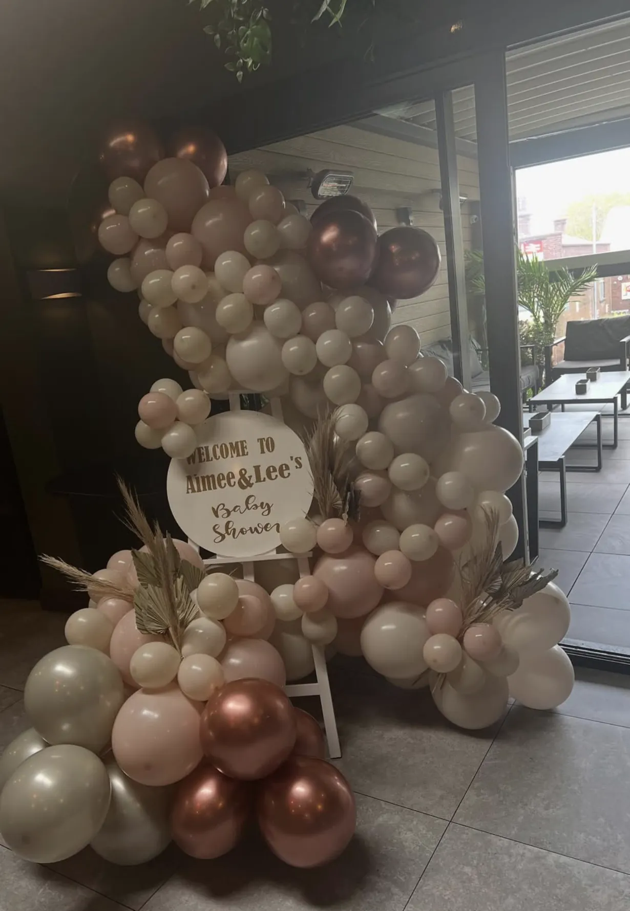 A balloon arch set up for an afternoon baby shower